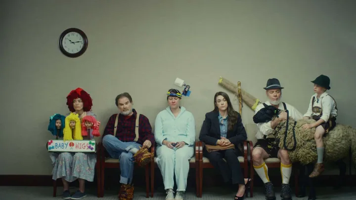A waiting room of costumed characters, from the Sheep Man spot in Marks Media's video campaigns for Nodaway Valley Bank