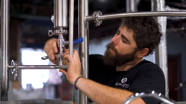 A brewer at work, from the River Bluff Brewing video by Marks Media